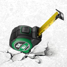 Tape measure embedded in concrete with a visible brand logo.